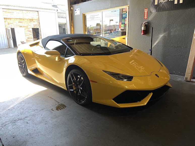 Yellow Lamborghini receiving performance service